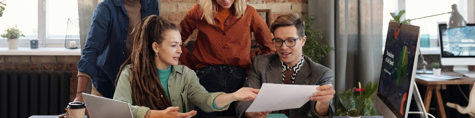 A PR firm sits around a table to discuss strategy.